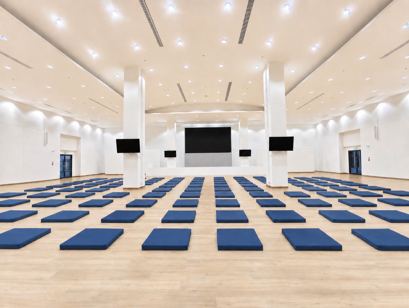 The retreat hall, a bright room with a mat laid out on the floor for each participant
